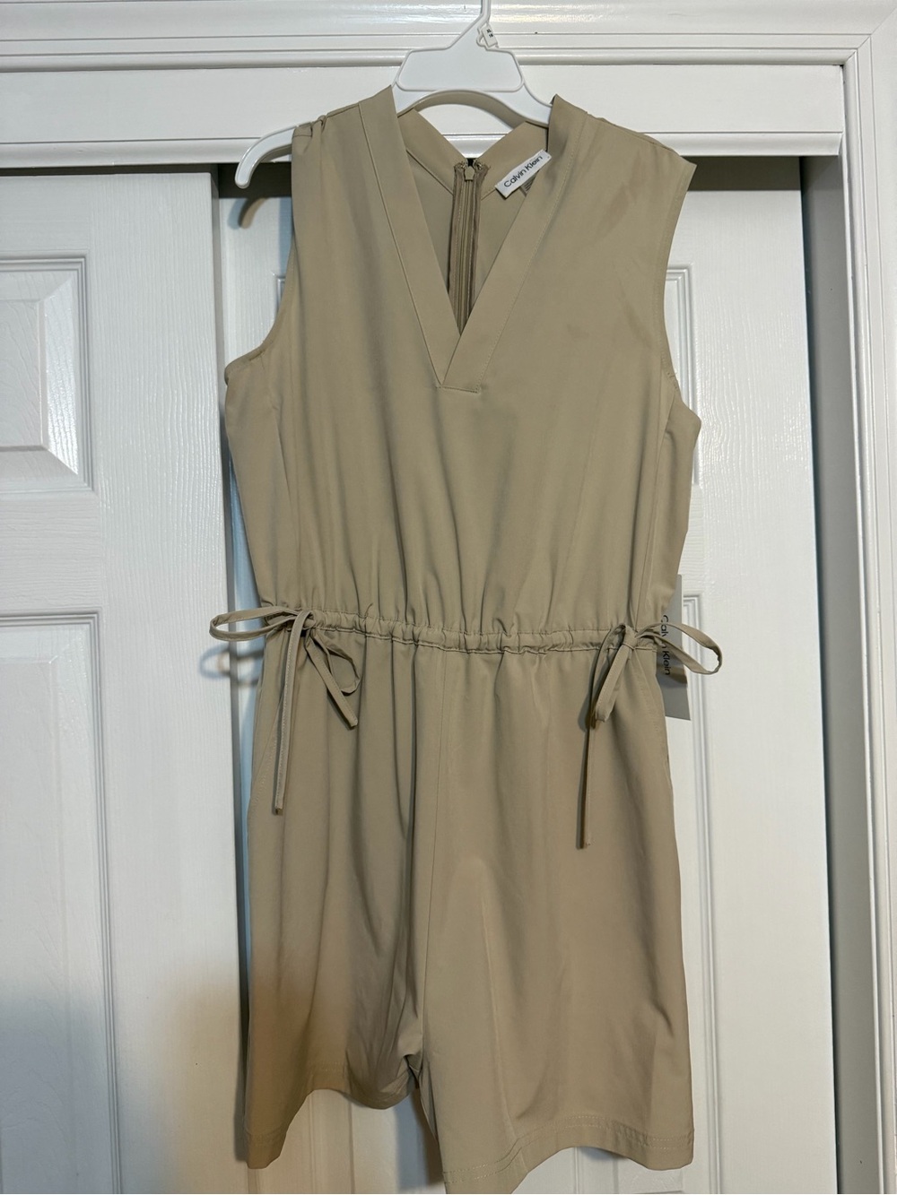 Calvin Klein Sleeveless V-Neck Drawstring Romper in Beige